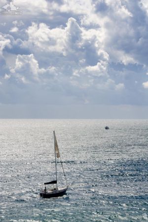 Sailing Yacht in Black Sea against Storm Clouds
